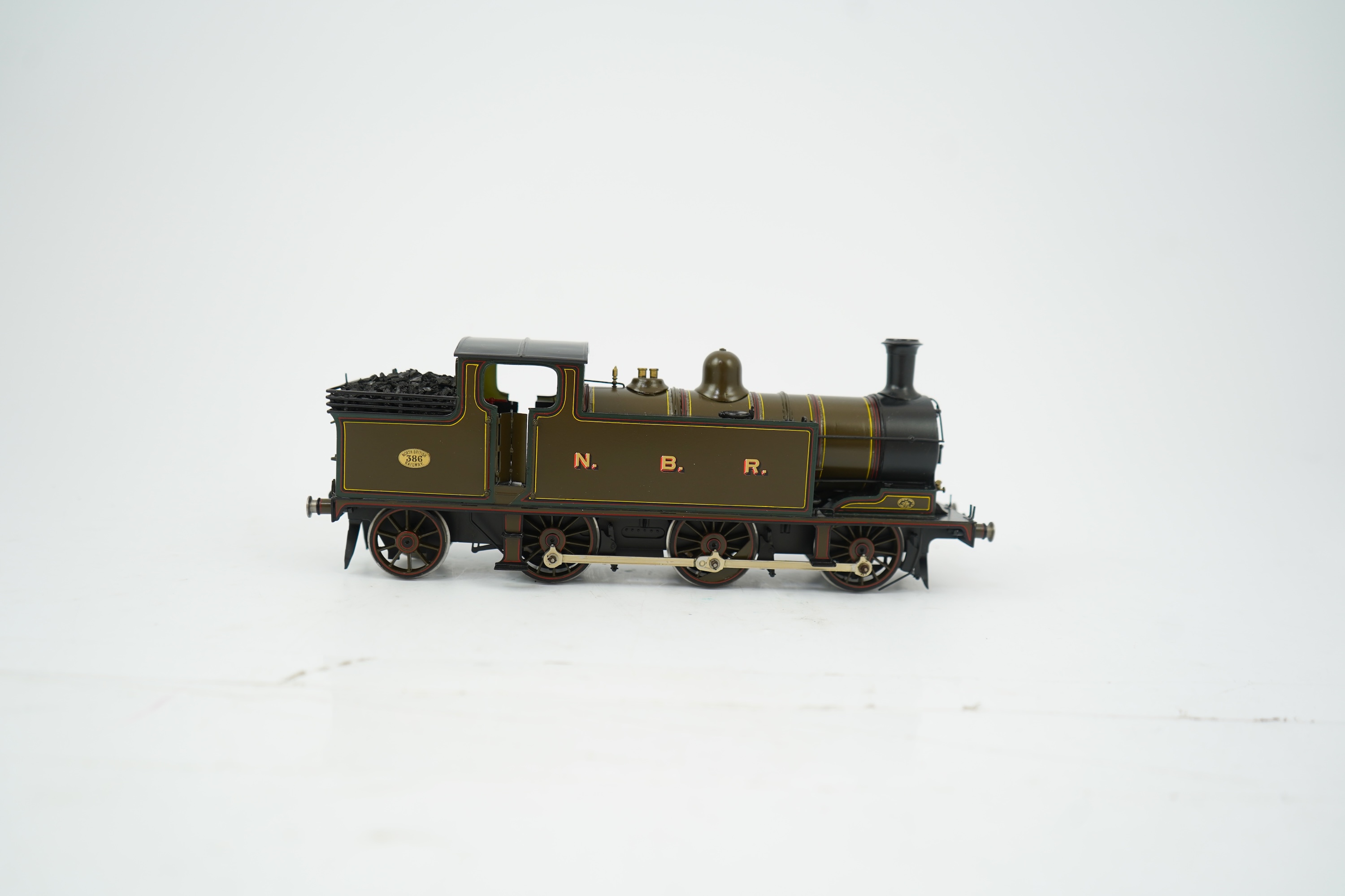 An 0 Gauge brass model of North British Railway William Reid Class A, 386, 0-6-2T locomotive, powered for two rail operation.